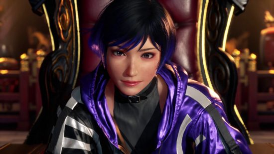 Image of female in purple in black clothing sitting in a cushioned chair.